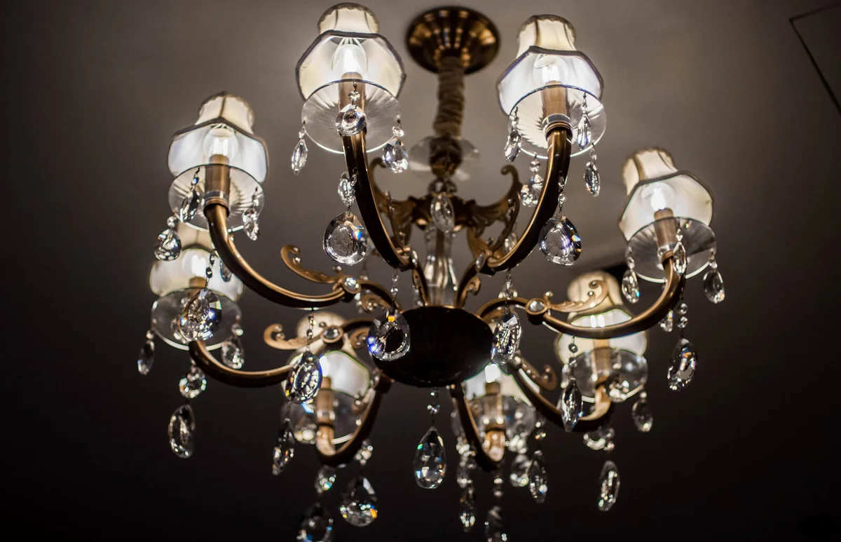 An old-fashioned chandelier on a ceiling