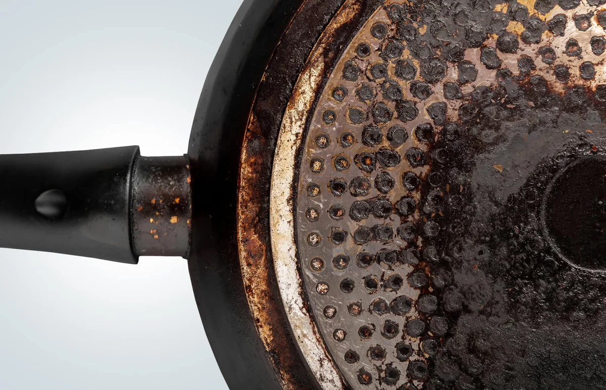 charred bottom of an old pan