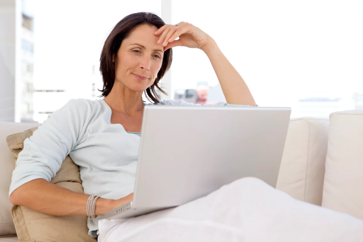 Woman using laptop at home