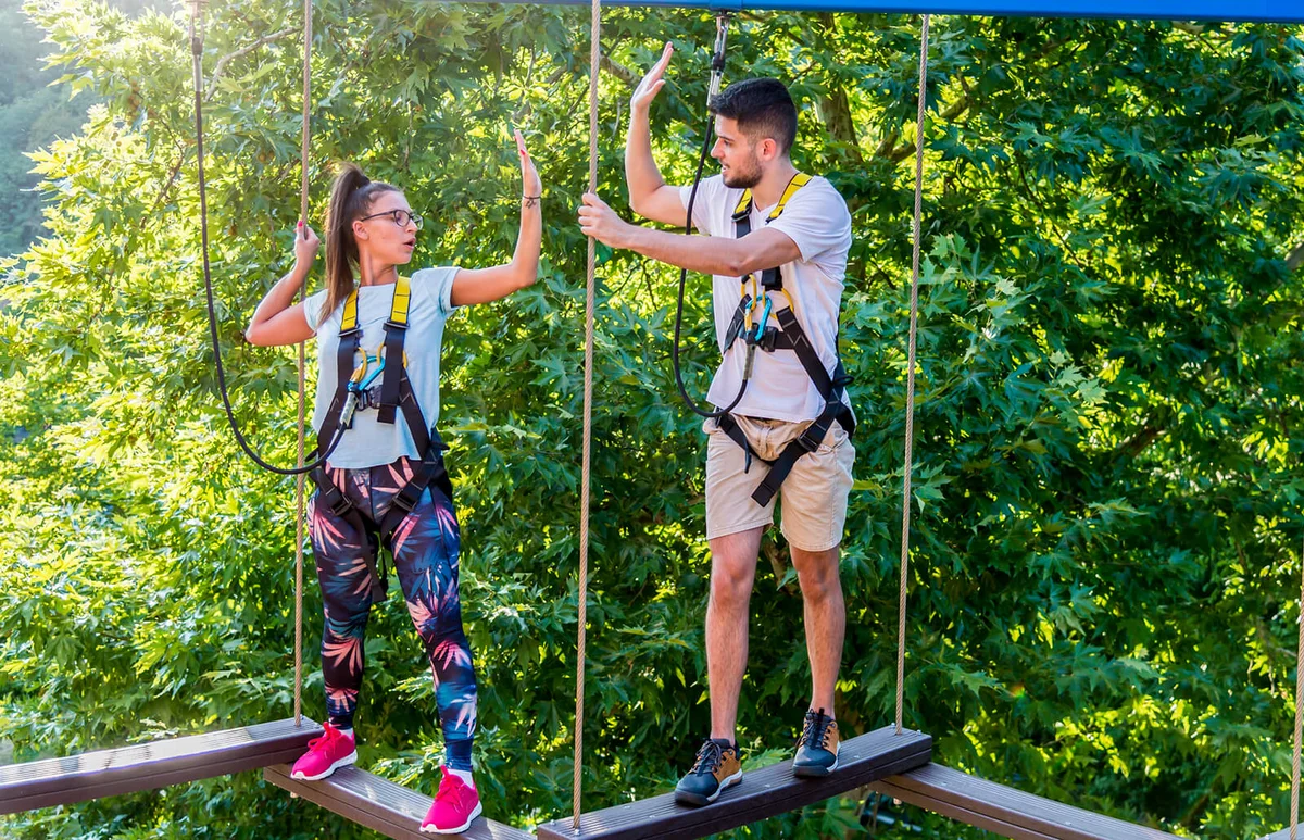 Young people have fun in the adventure park