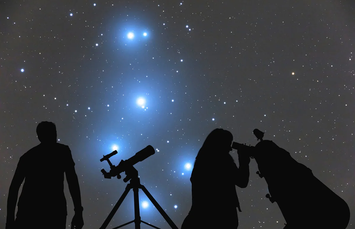Couple looking at the stars with telescopes