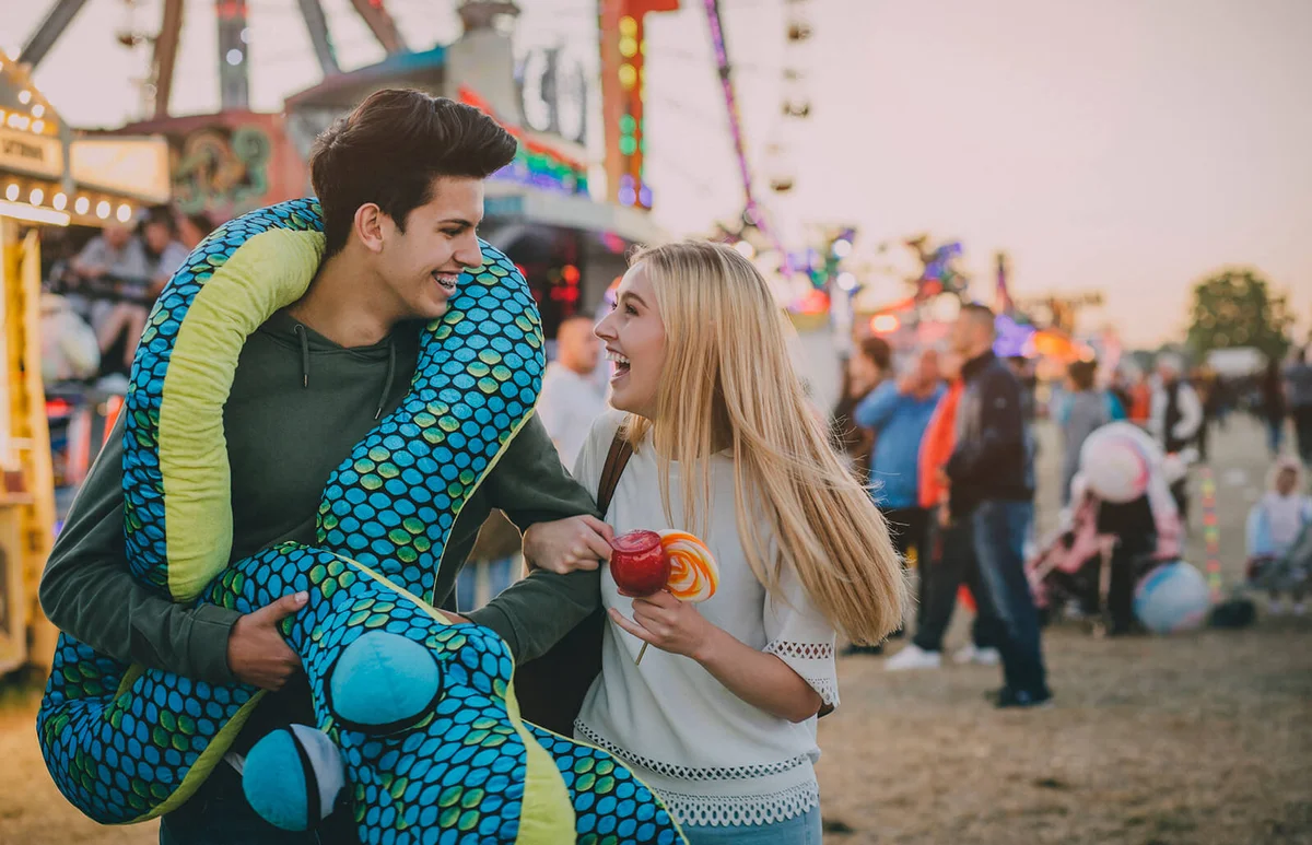 Boyfriend has just won a toy snake for girlfriend
