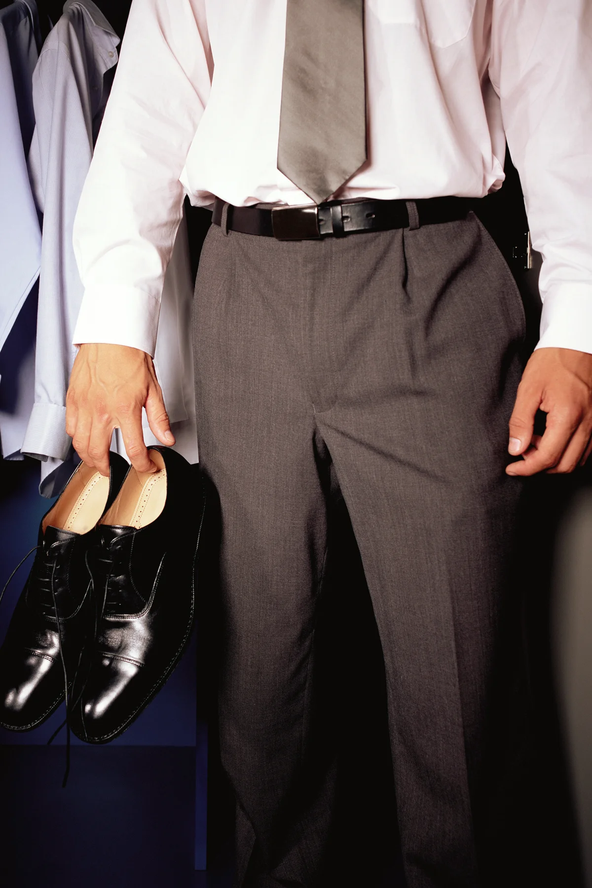 Man dressed in pants, shirt and tie