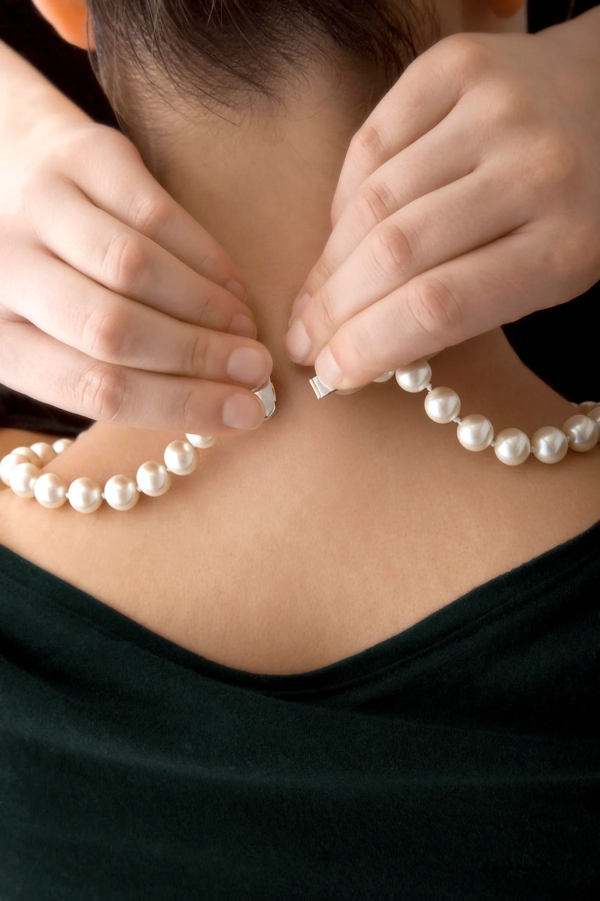 Woman wearing pearl necklace