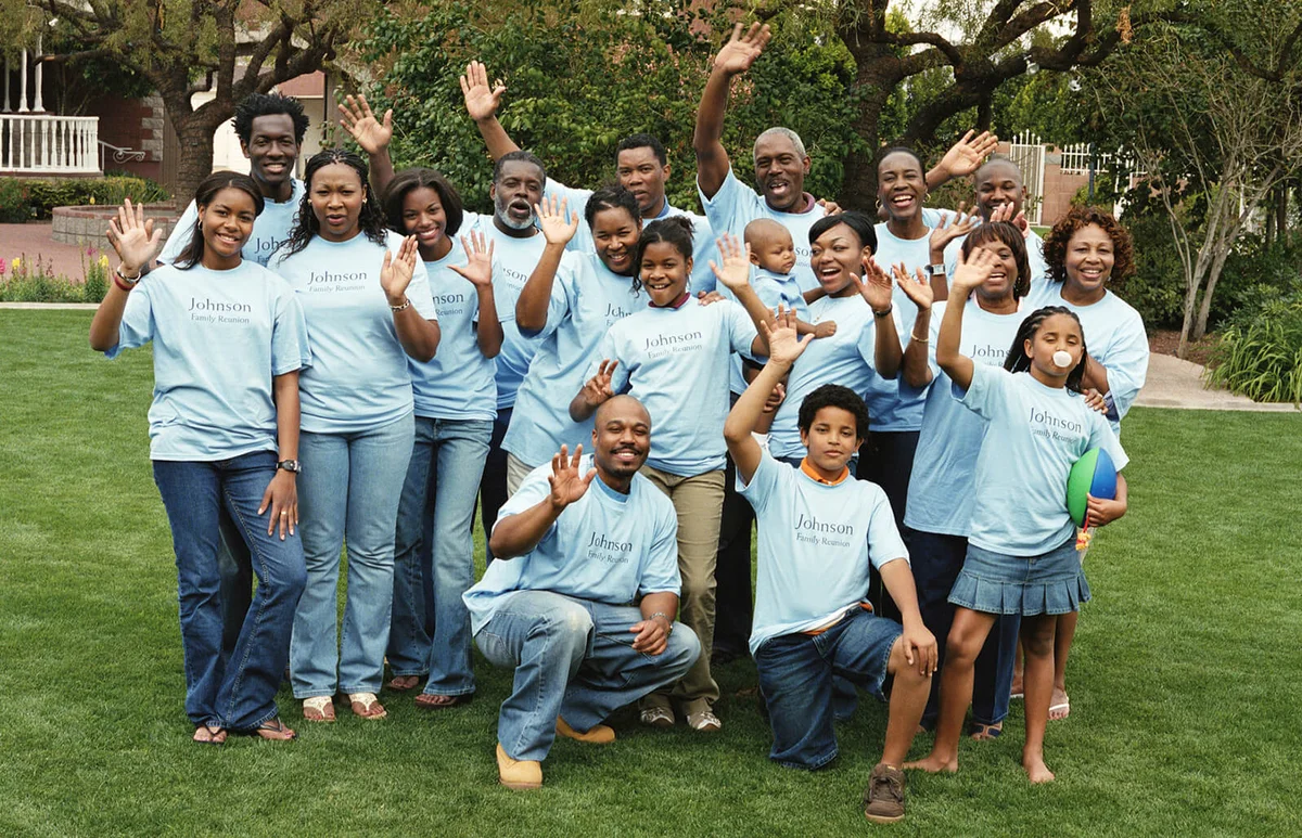 Multi generational family waving at reunion