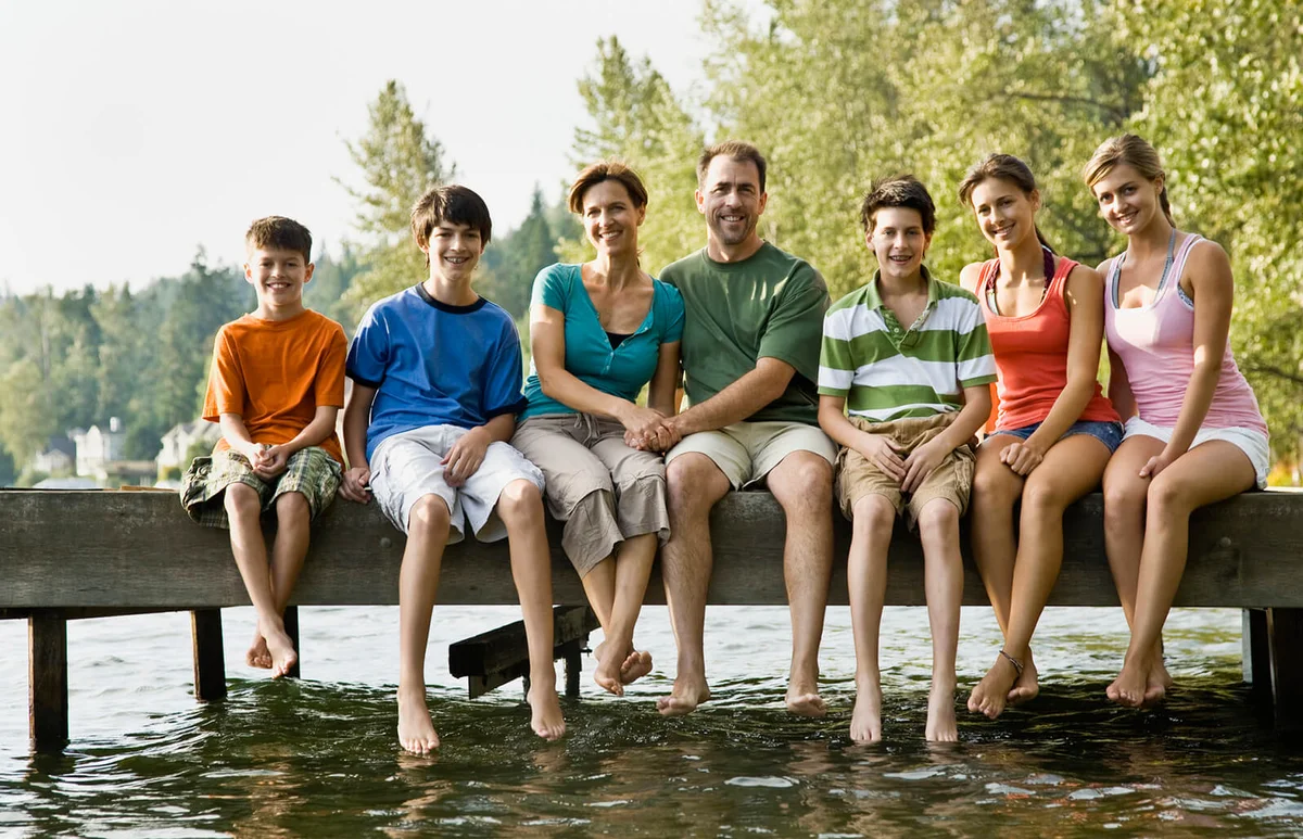 Family sitting on pier