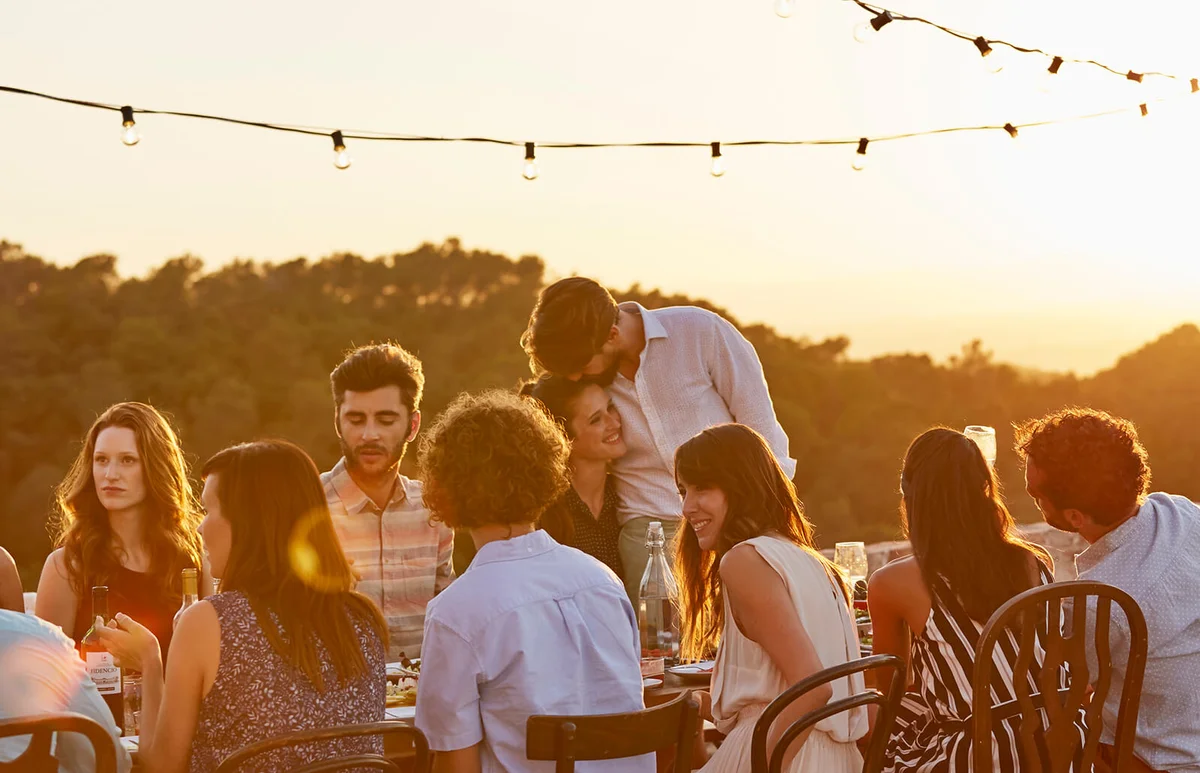 Friends enjoying at dinner party