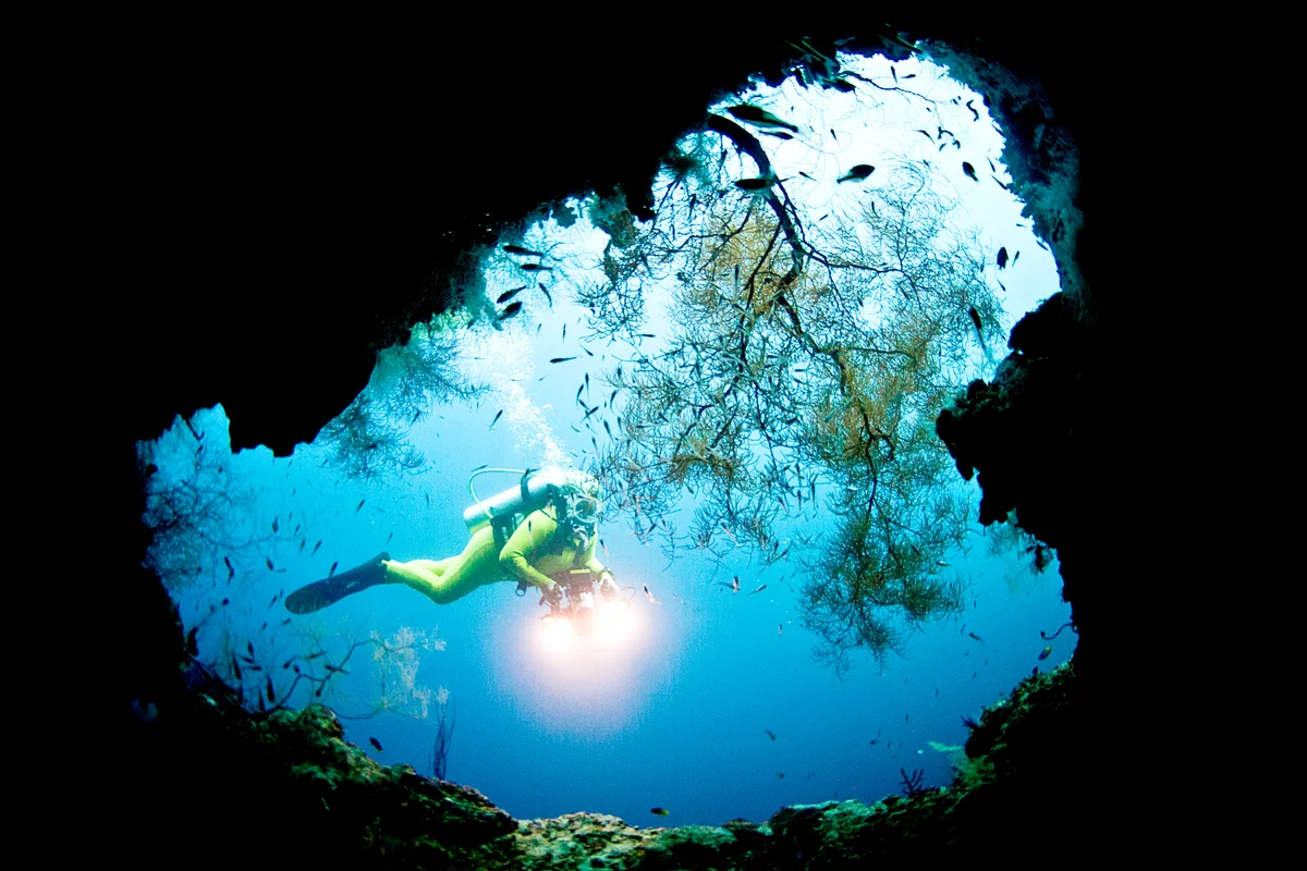 Deep sea diver in a cave