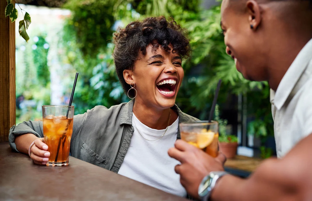 happy young couple having drinks