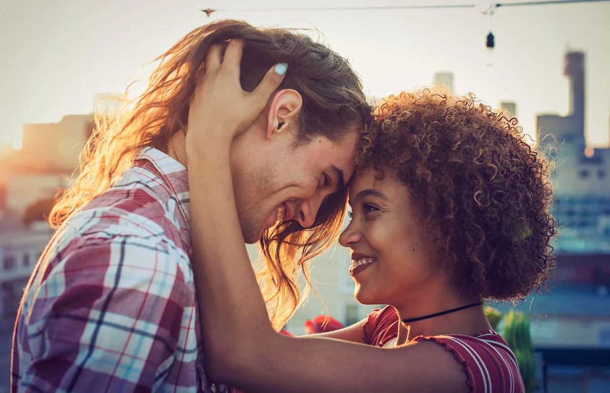 Couple embracing on urban rooftop