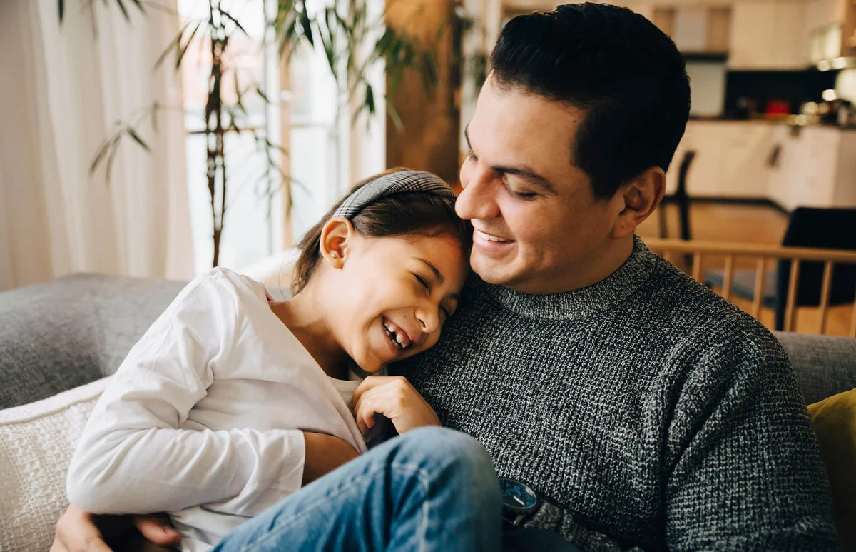 Smiling father and daughter spending leisure time