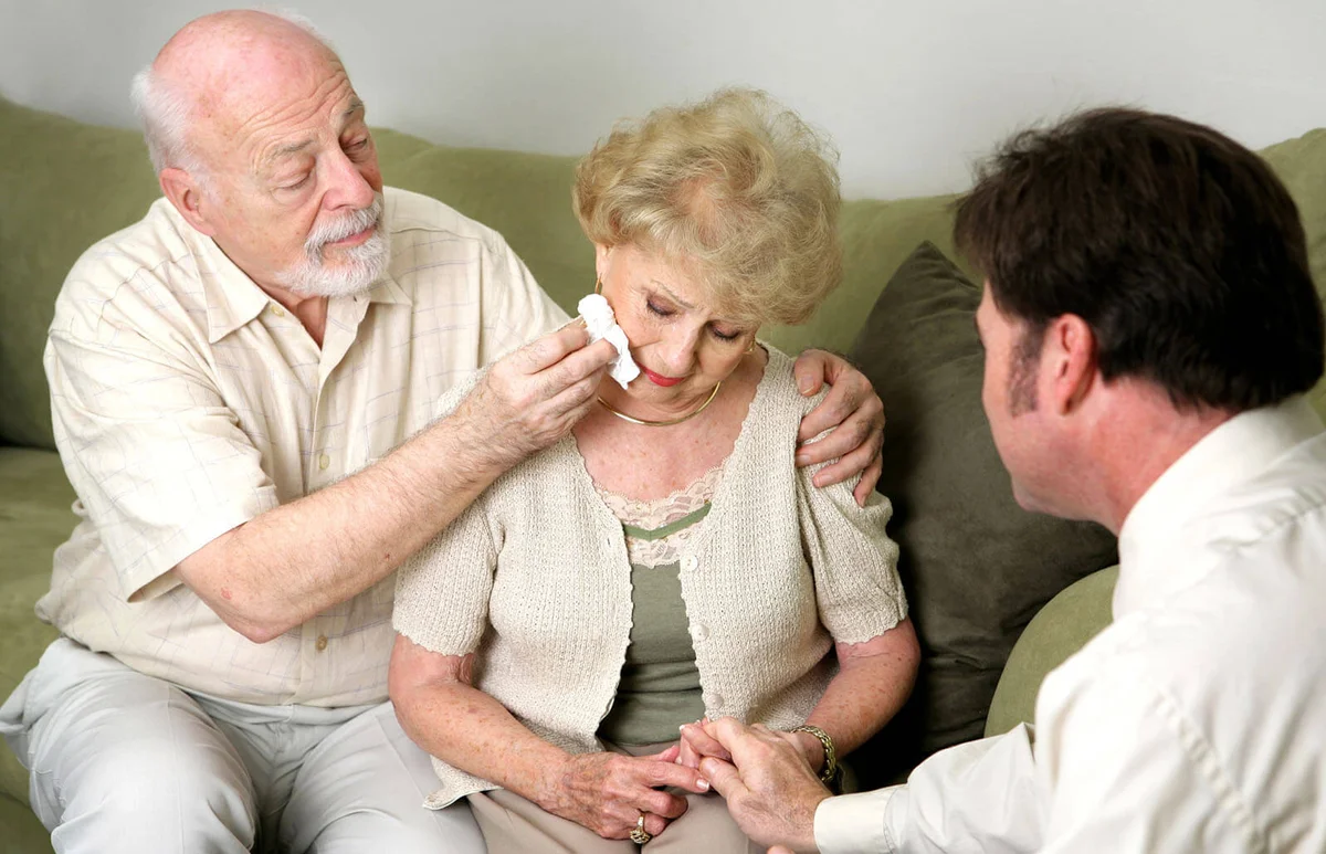 senior couple with funeral director