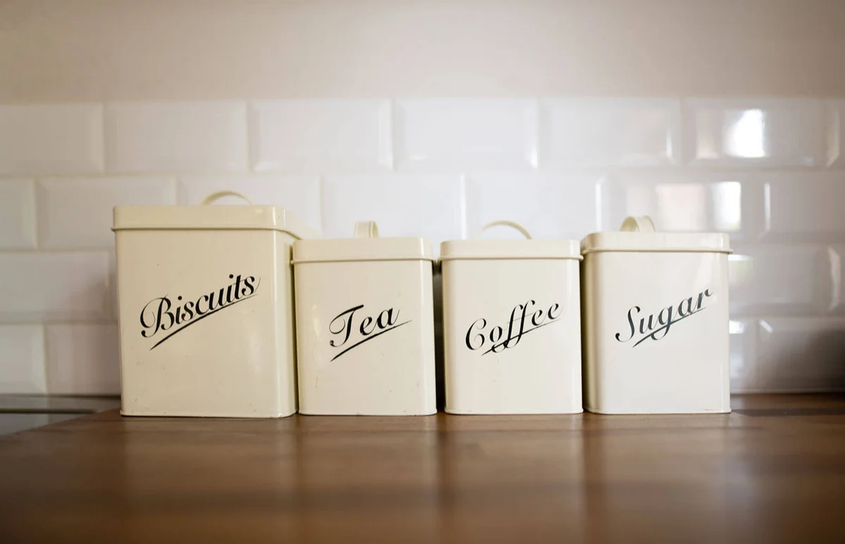 Row of storage tins