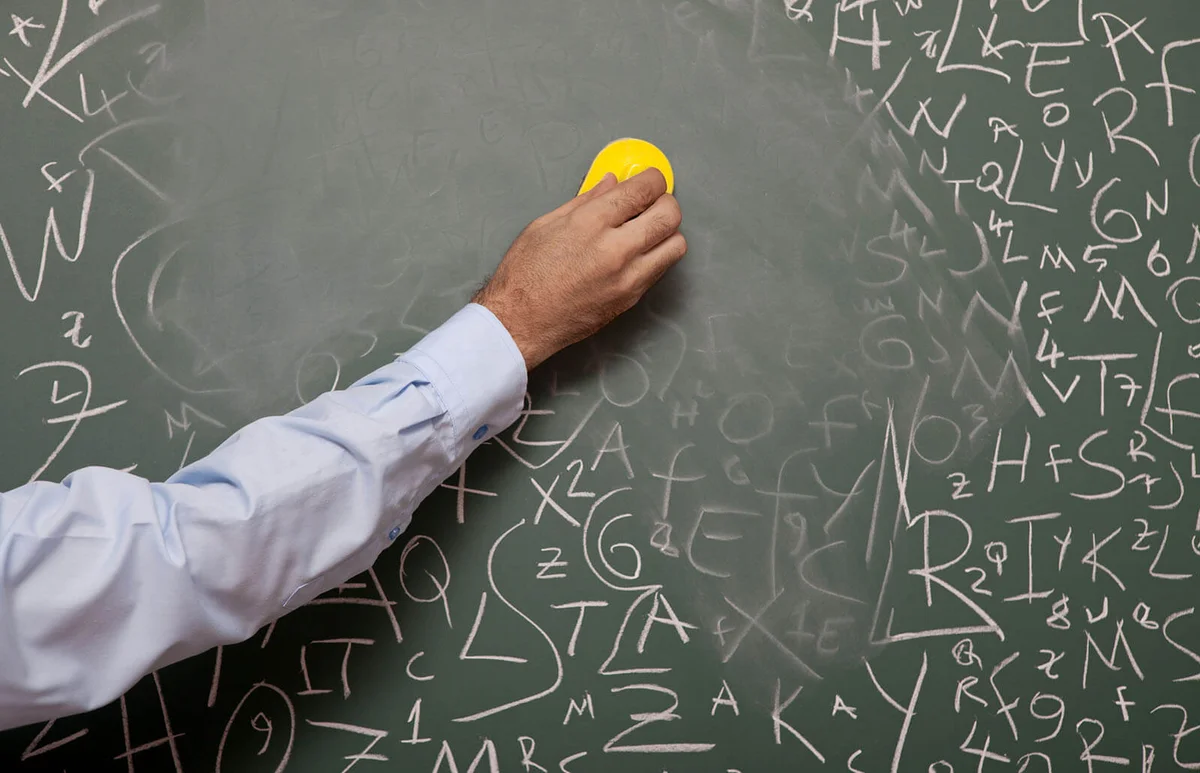 hand erasing chalkboard