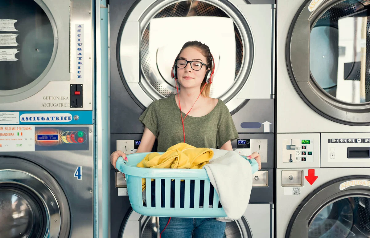 Young woman in a launderette