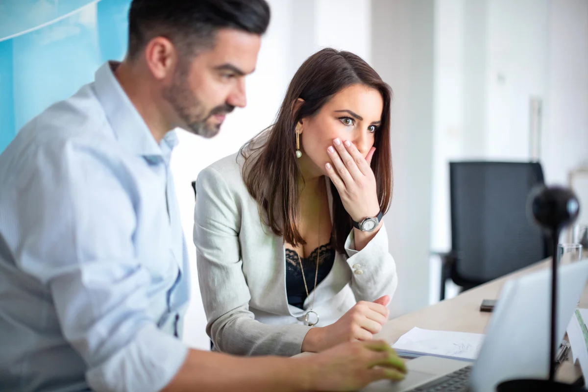 Two coworkers receiving sad news