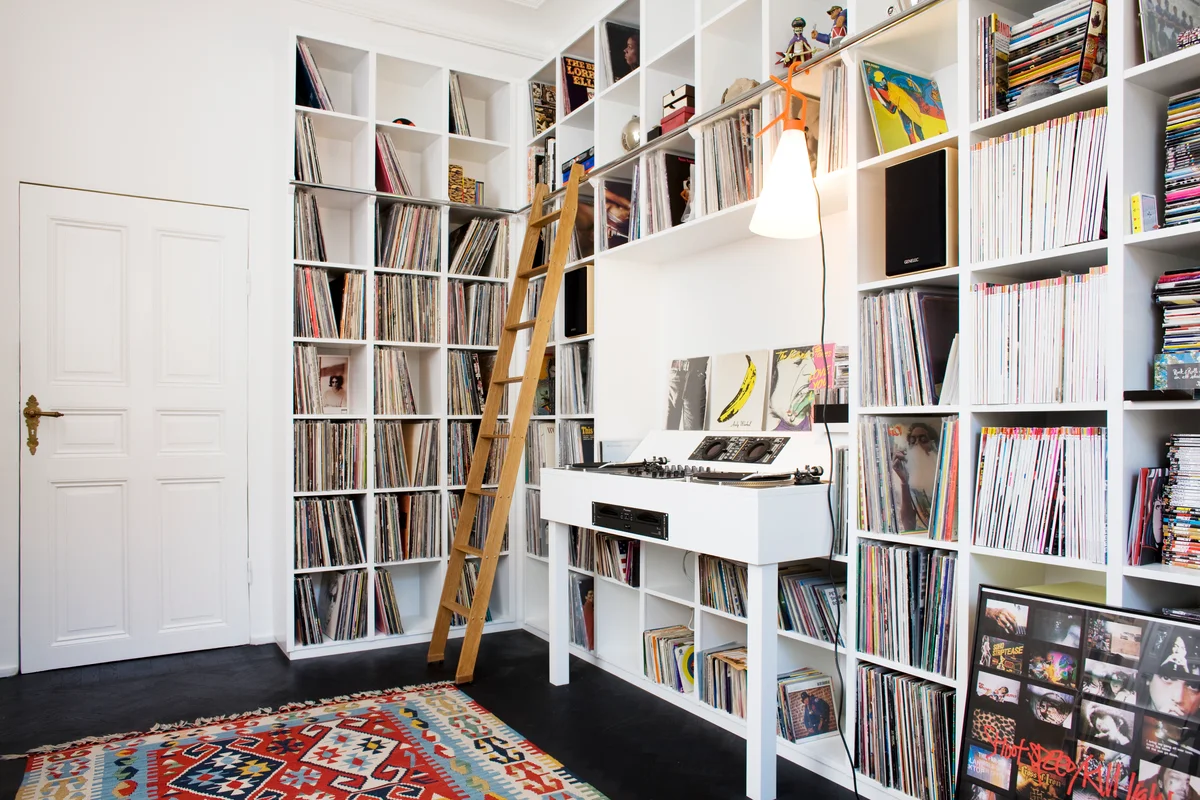 music room featuring record storage in a wall unit