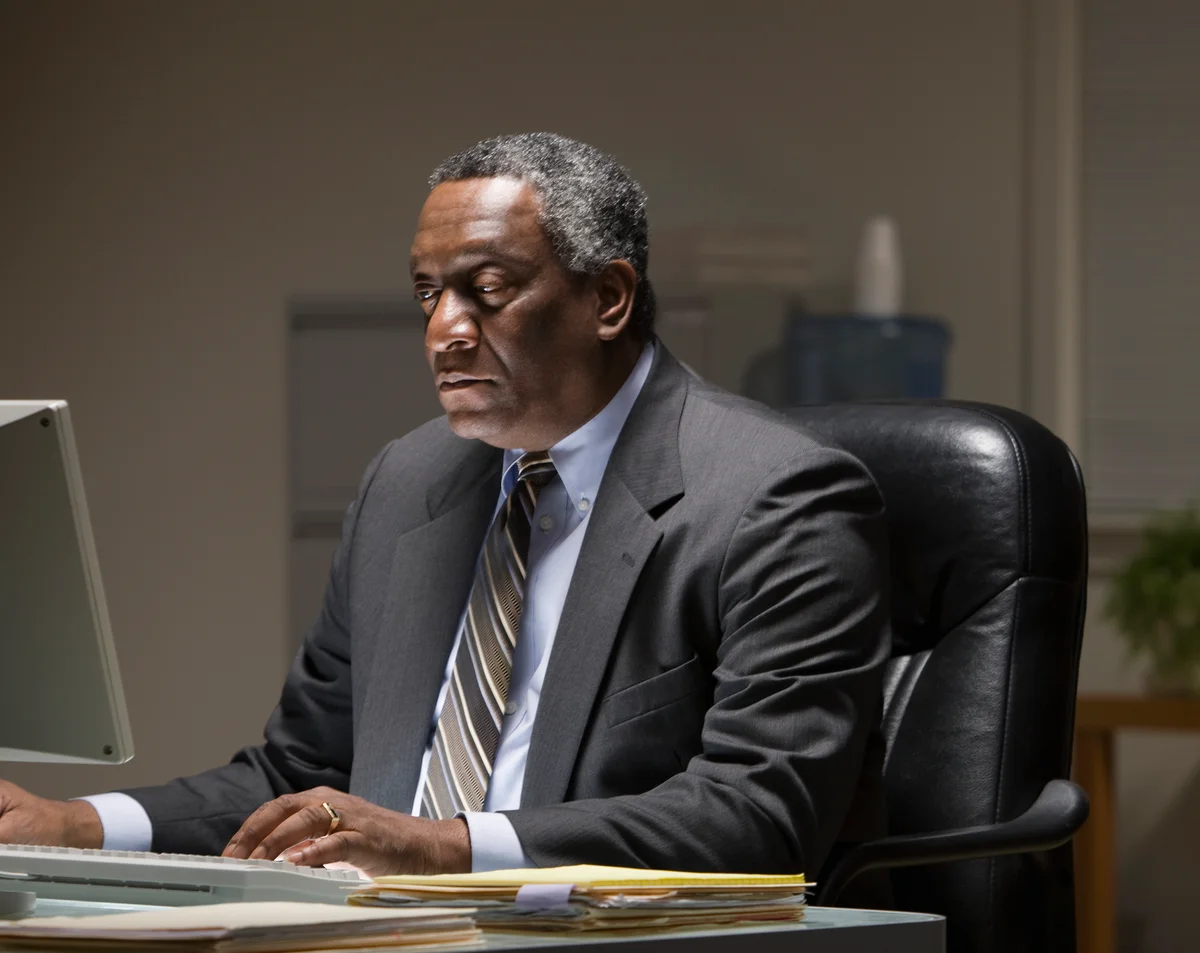 Man attending virtual funeral