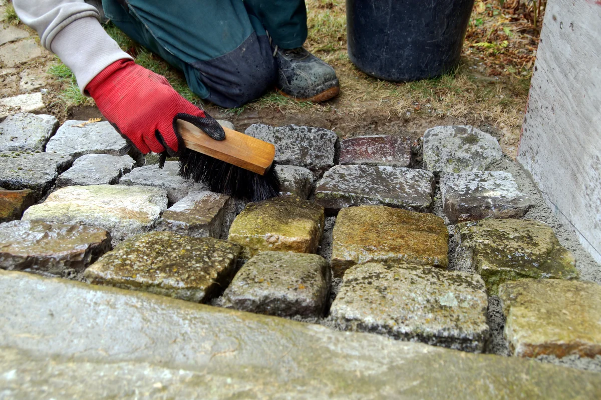 cleaning brick with stiff bristle brush