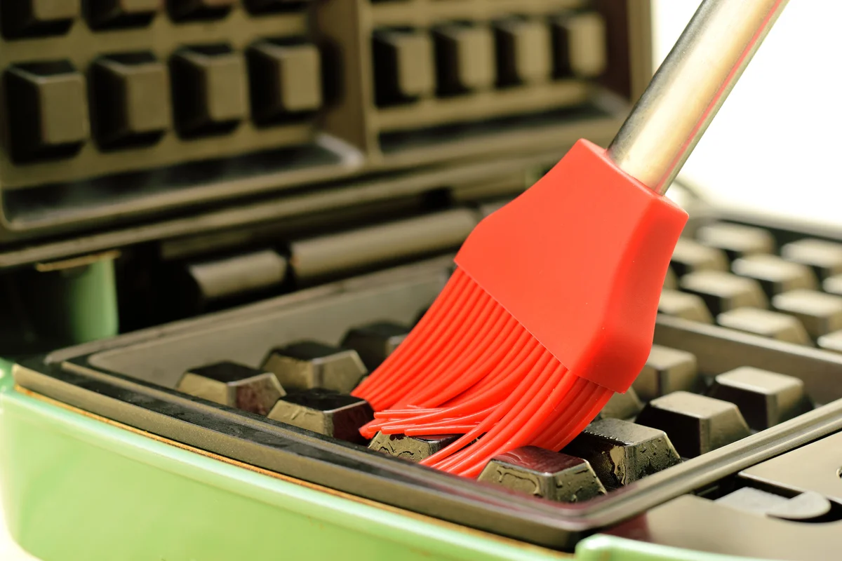 using a silicon brush cleaning waffle iron