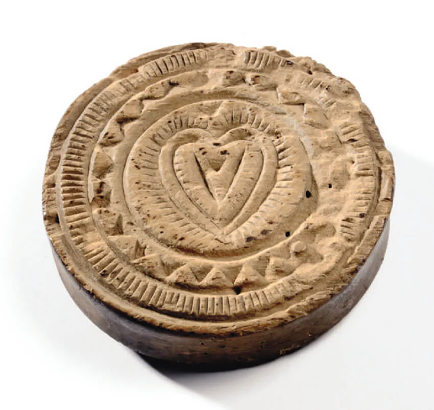 A funeral cake marker - these cake markers were locally made hand carved wooden stamps used to decorate funeral cakes. Possibly made by each family for their own use in the late 19th Century