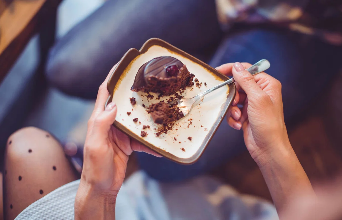 Chocolate cake serving half-eaten