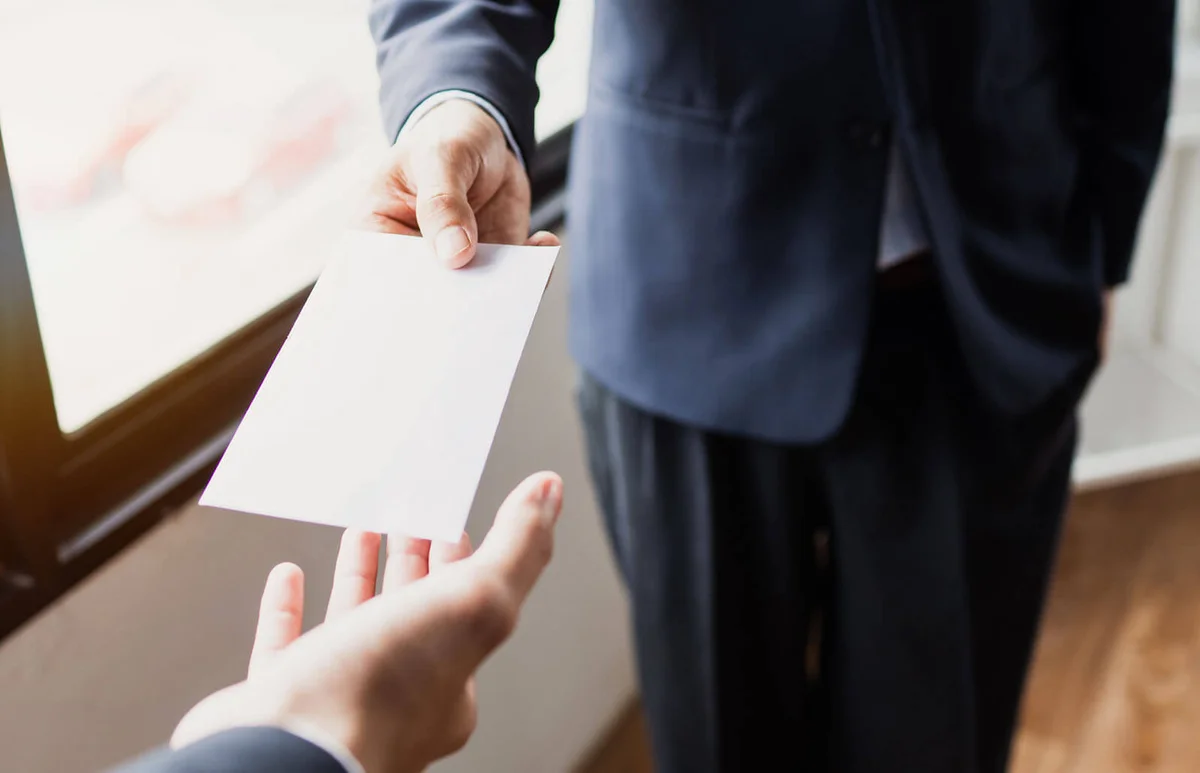 handing a simple envelope
