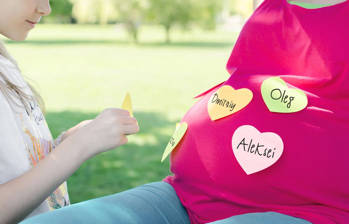Mother and daughter choosing baby names