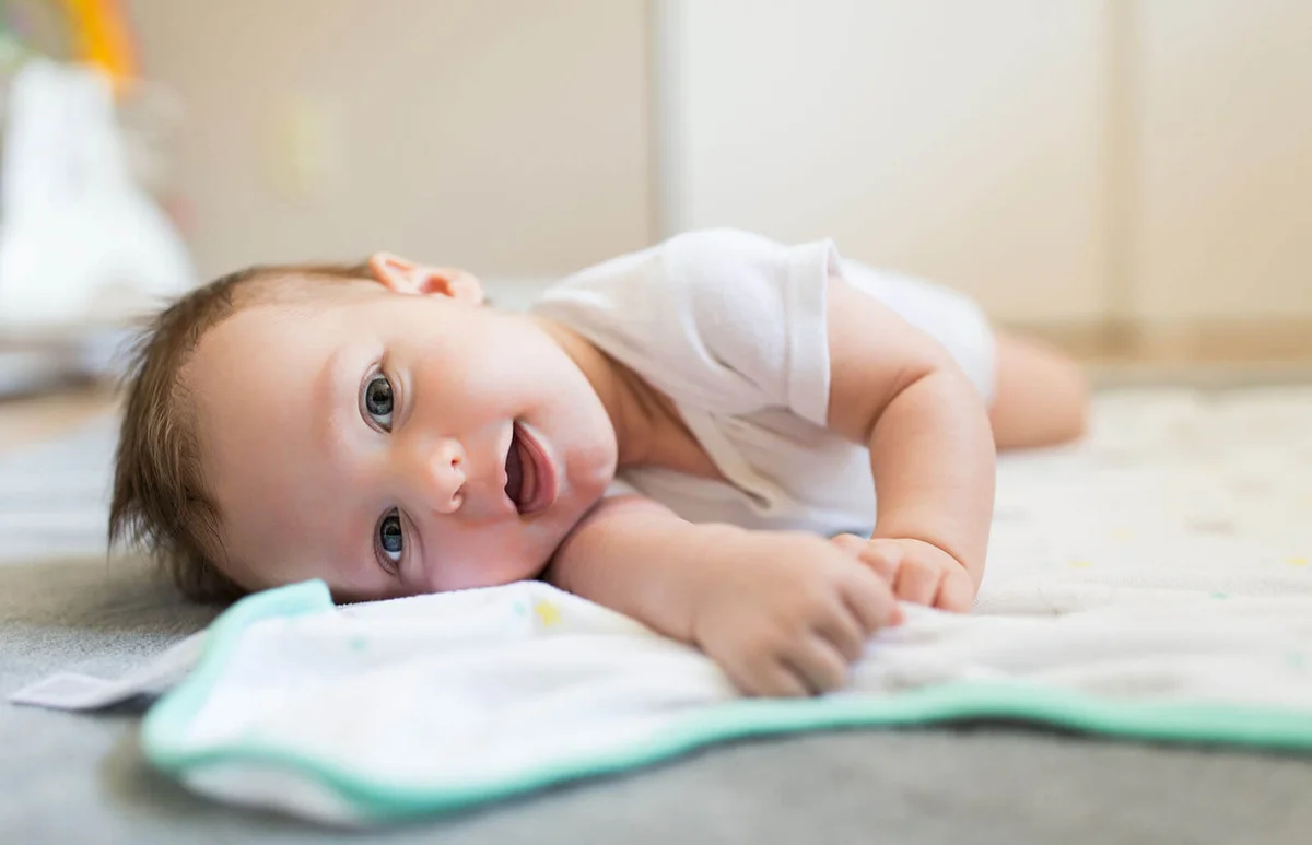 playful baby looks happy