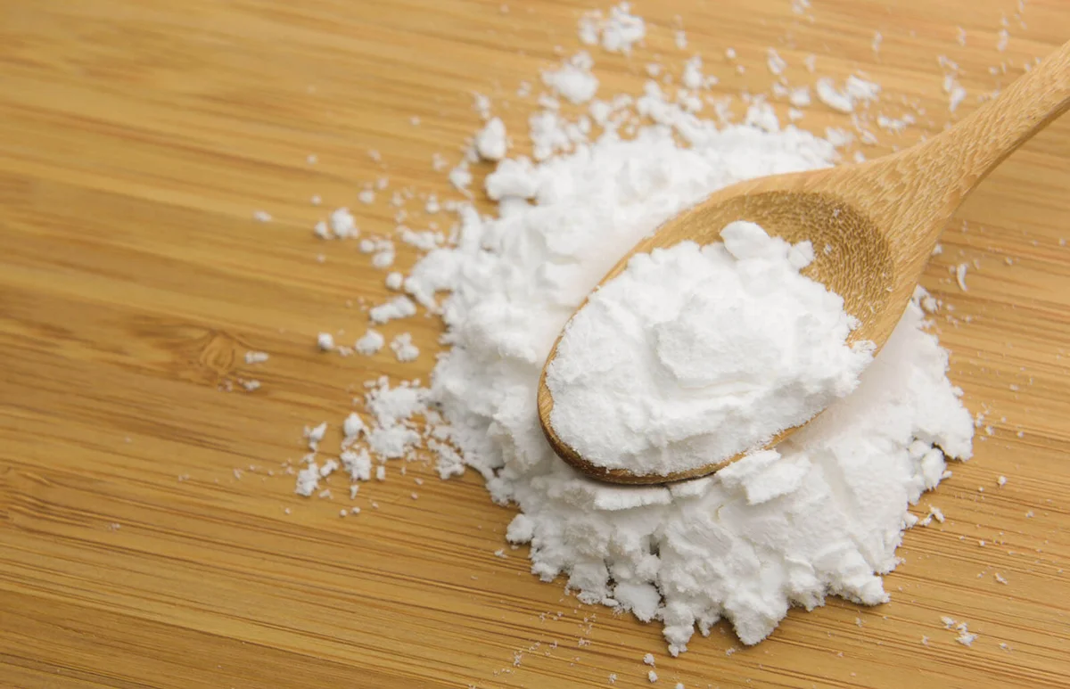 starch or flour powder in wooden spoon