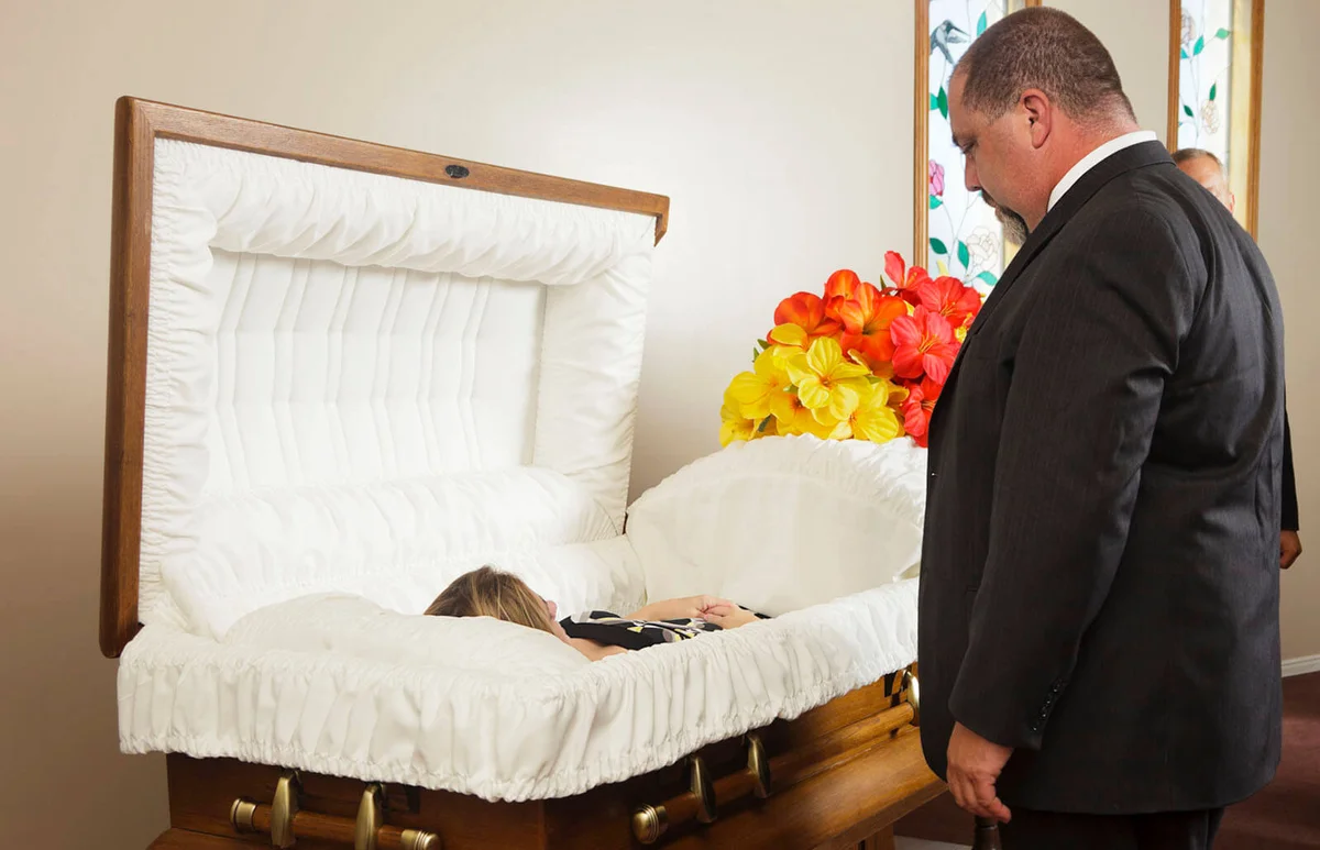 father mourning over the death of his daughter