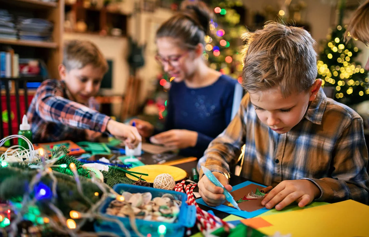 Family crafting Christmas cards