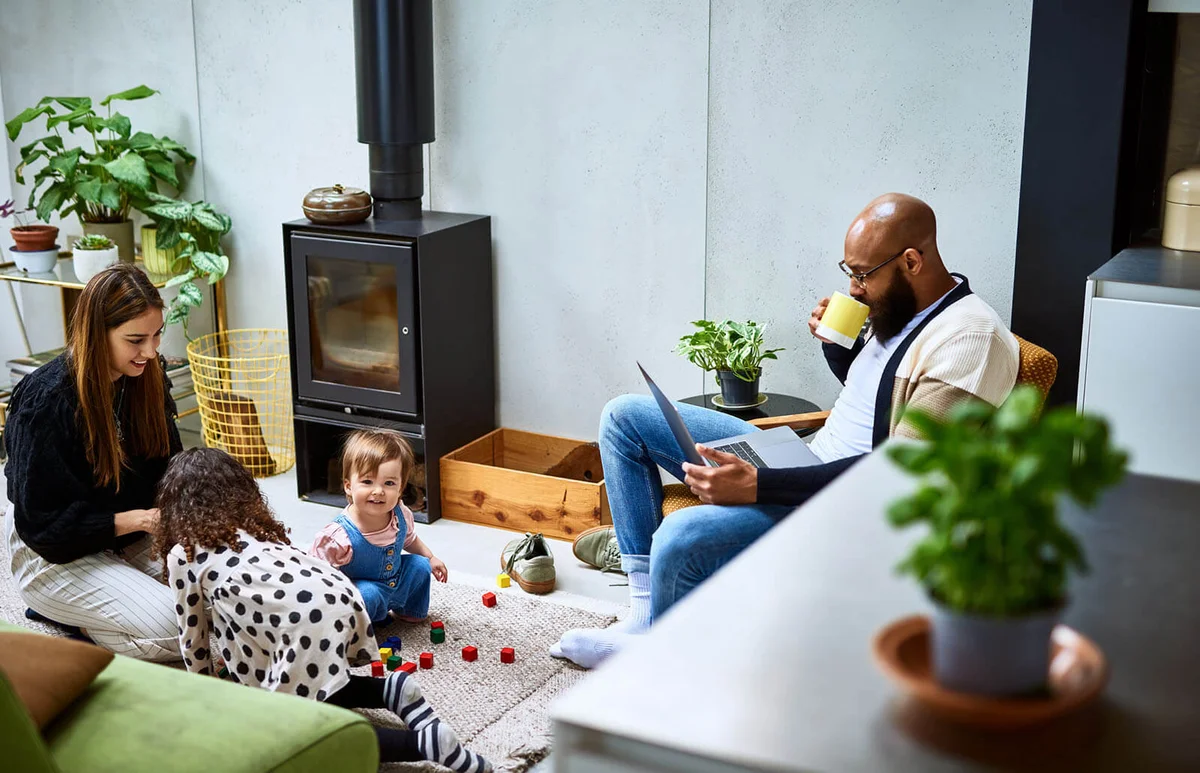 Mother and father at home wit h two daughters