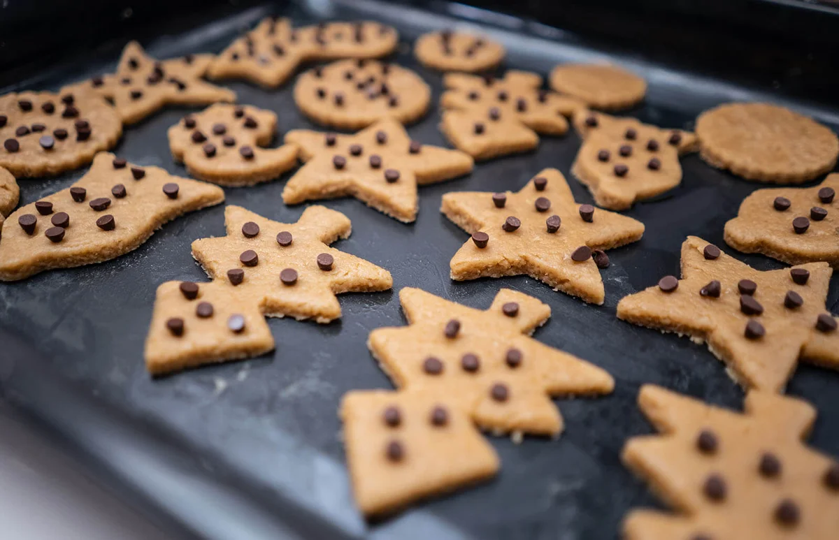 Putting Christmas cookies in the oven