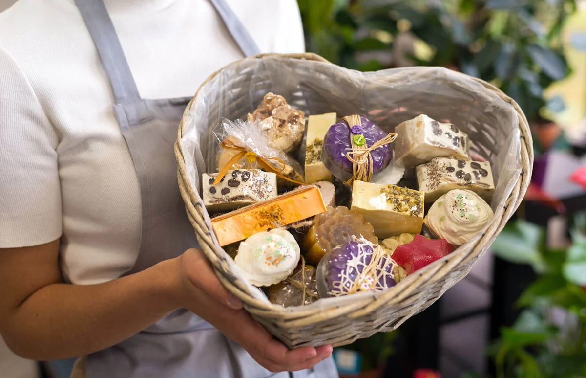 Woman holding basket with home made soaps
