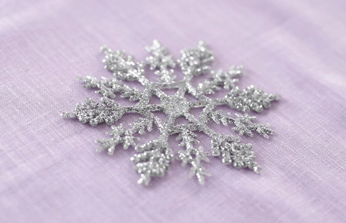 Crystal-shaped coaster on tablecloth