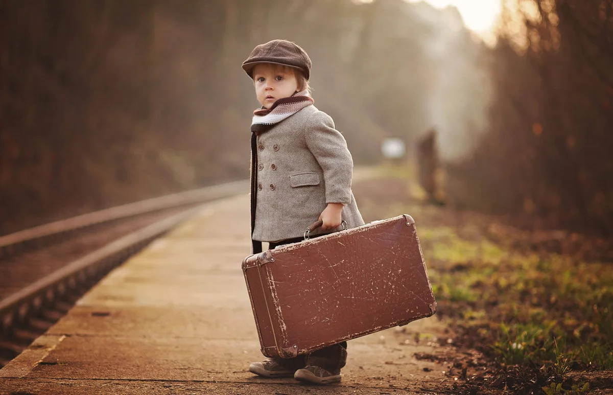Adorable boy on a railway station