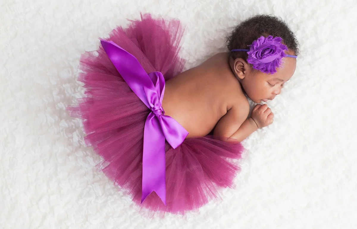 Newborn Baby Girl Wearing a Purple Tutu
