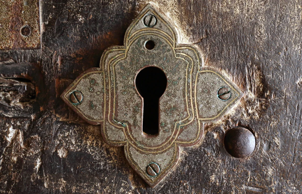 ancient keyhole on a door to a Buddhist cave temple