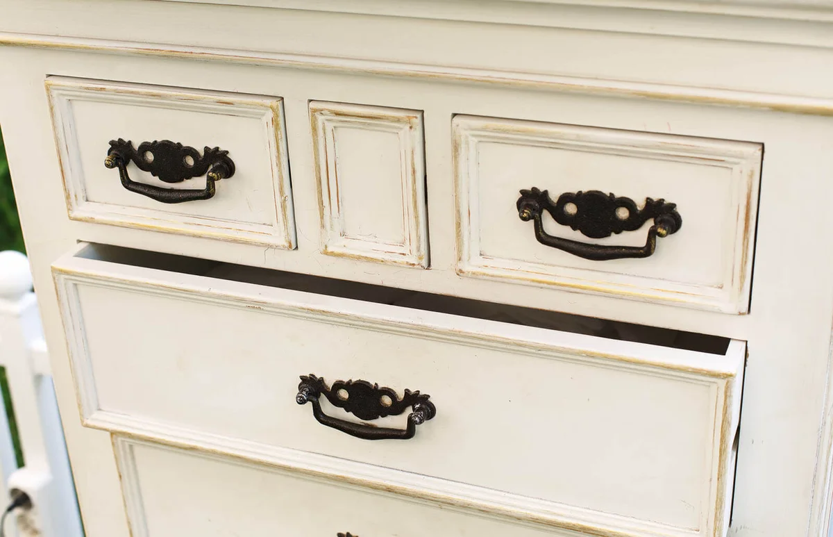 Vintage wooden chest of drawers with black metal handles open