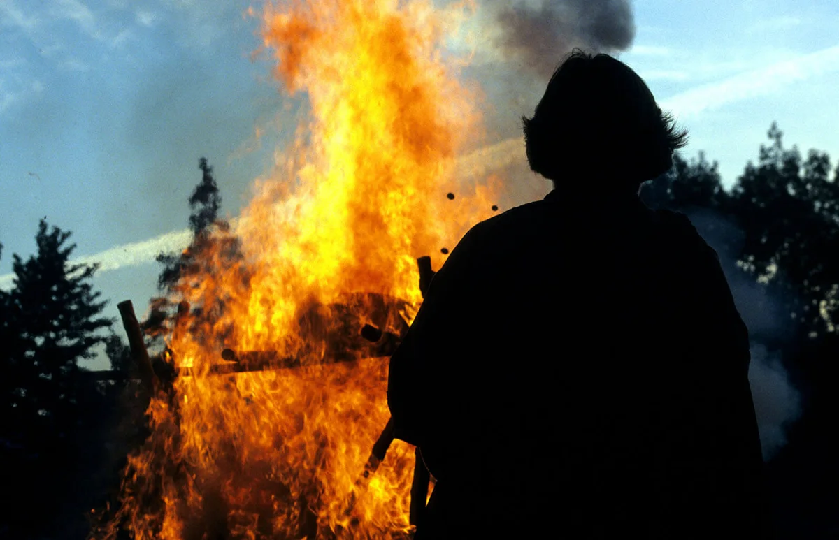 Man's silhouette in front of a cremation