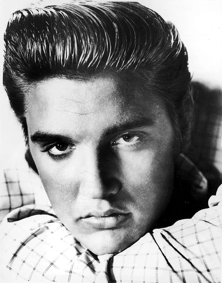 Elvis Presley poses for a portrait circa 1955