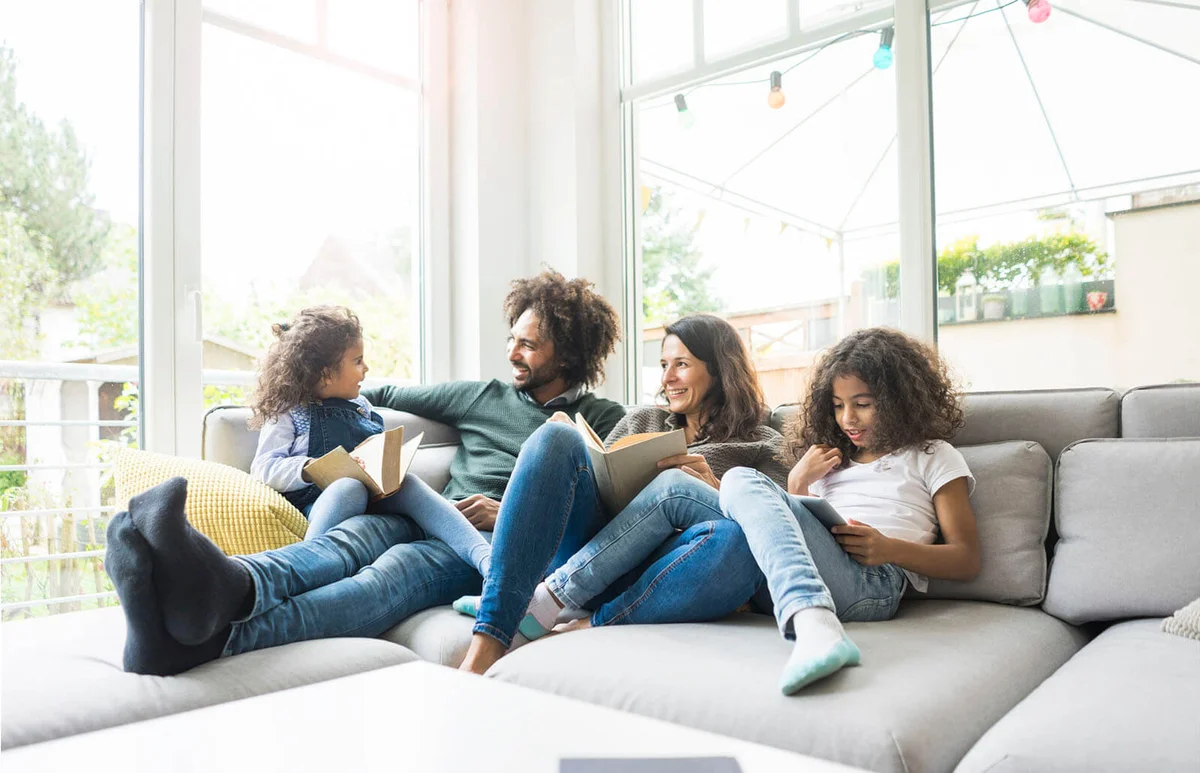 Happy family sitting on couch