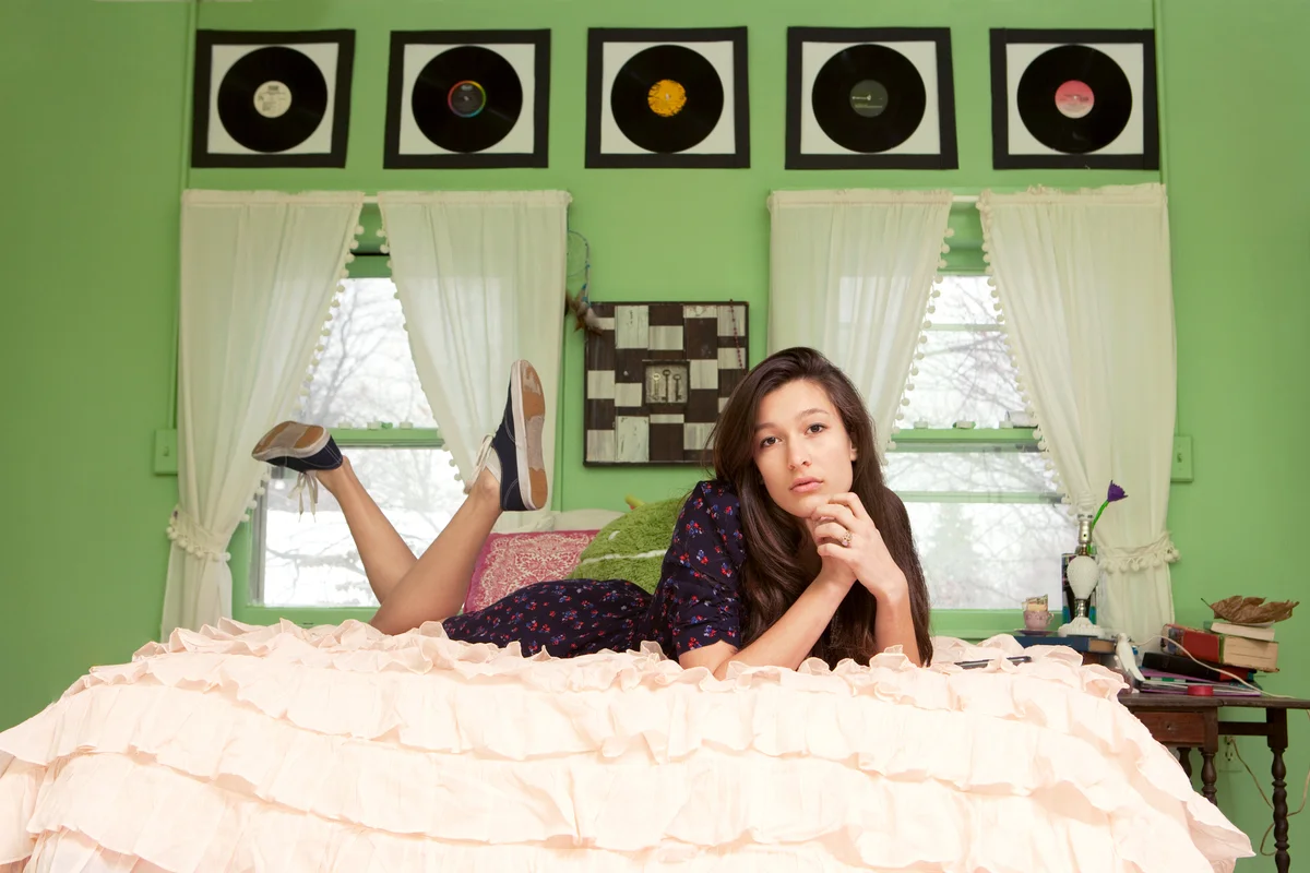 Teenage girl lying on bed