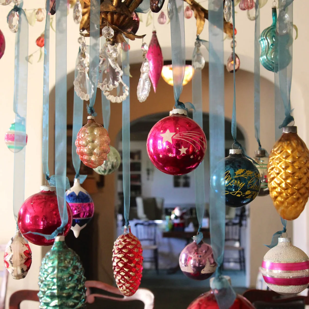 Shiny glass Christmas ornaments on a chandelier