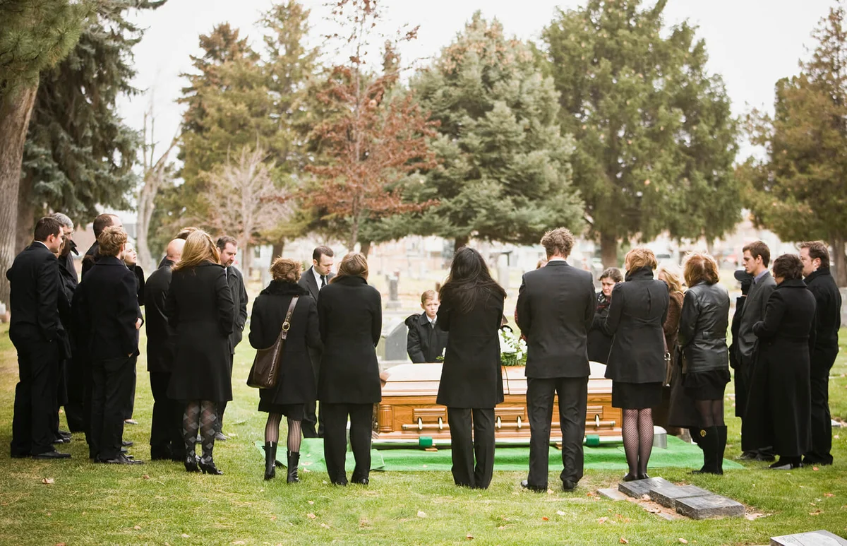 people at graveside service