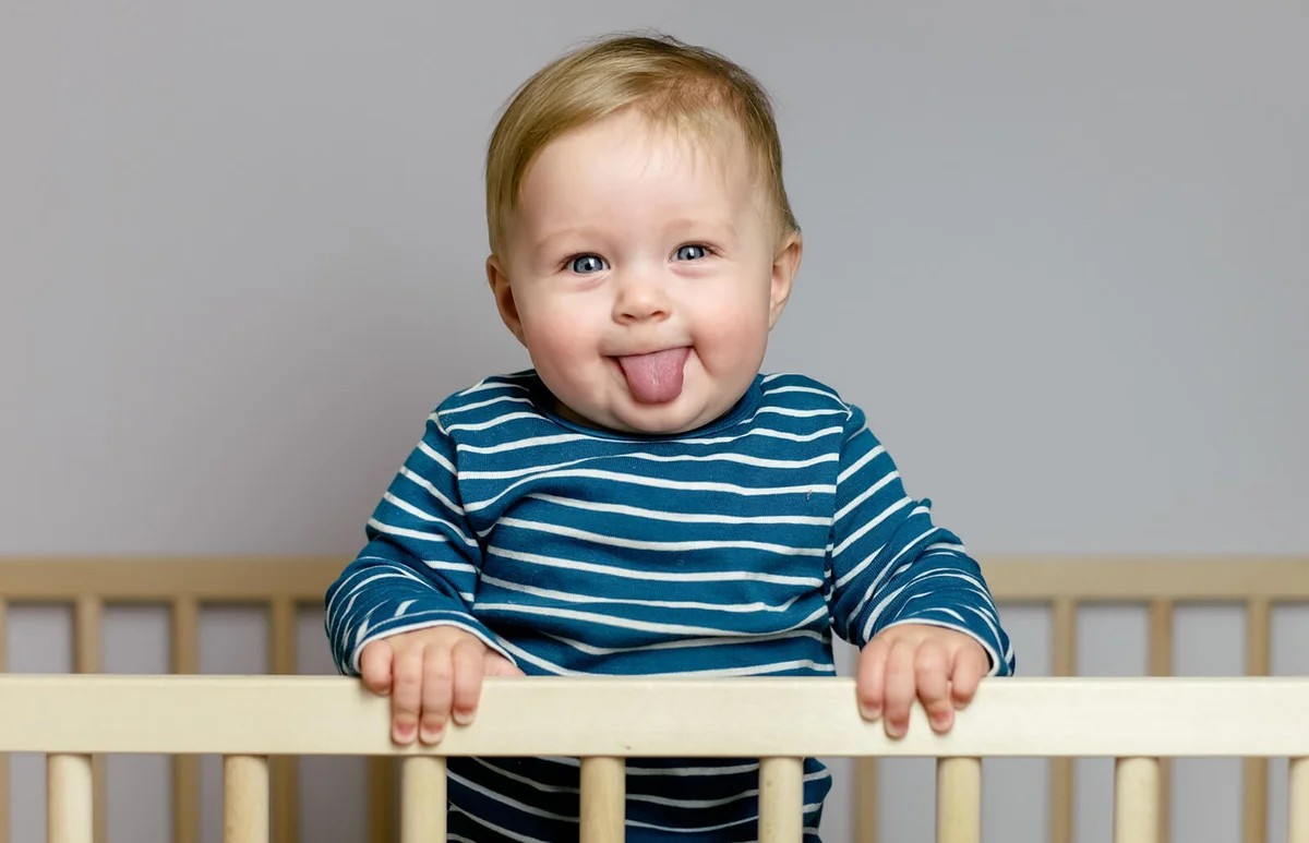 Baby playing in the crib
