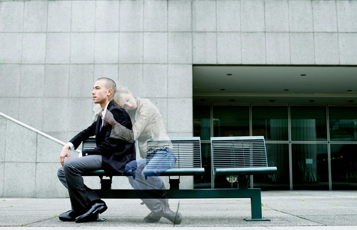 'Ghost' of woman embracing young man on bench