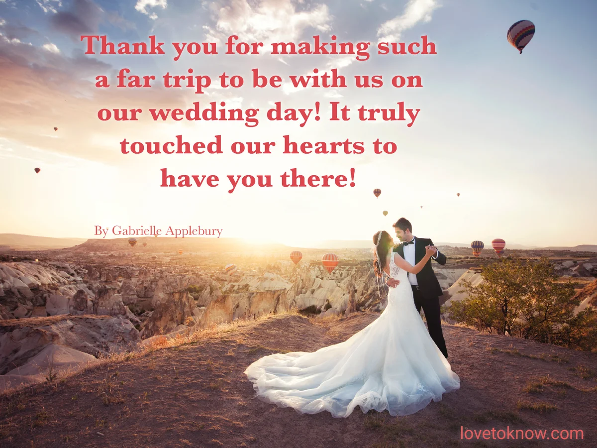 Married couple at sunset with hot air balloons in the background with a thank you message quote for wedding guests