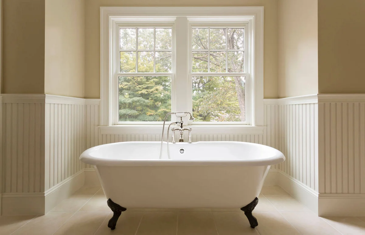 Clawfoot bathtub in custom designed bathroom